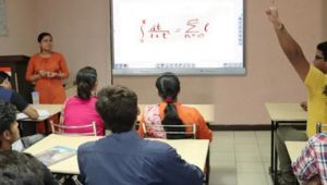Instructor using smart classroom technology to engage students in an interactive session